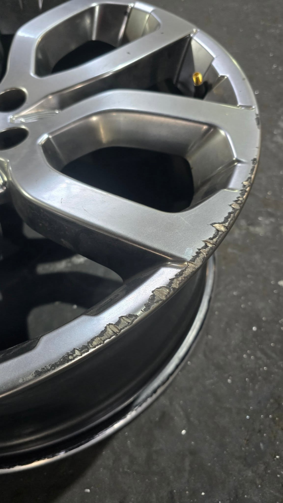 21-inch luxury rims with perimeter curb rash